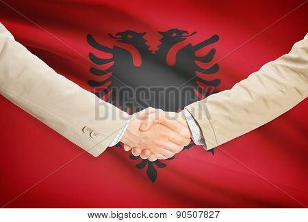 Businessmen Handshake With Flag On Background - Albania