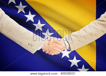 Businessmen Handshake With Flag On Background - Bosnia And Herzegovina
