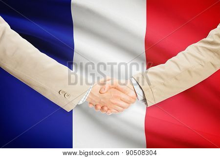 Businessmen Handshake With Flag On Background - France