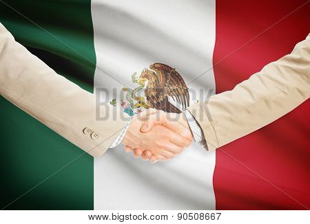 Businessmen Handshake With Flag On Background - Mexico