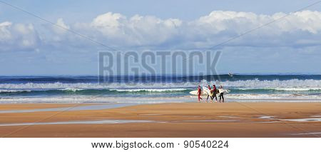 Costa da Caparica, Portugal. April 19, 2015: Surfers searching for the best spot. Caparica is an iconic location for surf in Portugal because its one of the pioneer beaches and quality of waves