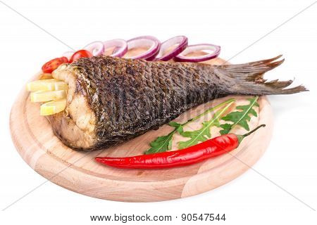 Fried carp tail with lemon and pepper.