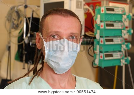 Portrait Of  Male Nurse Icu  In A Green Uniform.