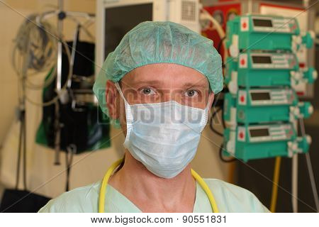 Portrait Of  Male Nurse Icu  In A Green Uniform.