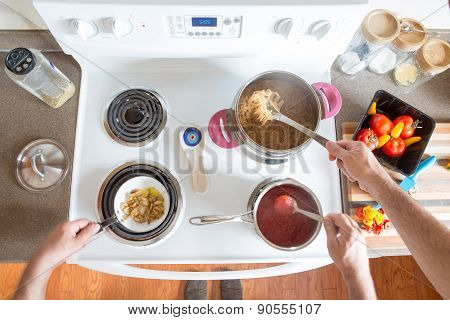 Two Men Preparing Healthy Wholewheat Spaghetti