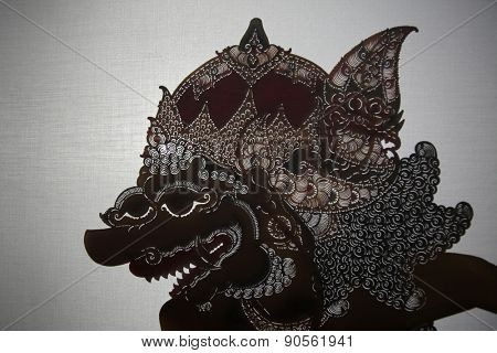 YOGYAKARTA, INDONESIA - AUGUST 13, 2012: Traditional Indonesian shadow puppet theatre wayang kulit performs on street during a religious festival in Yogyakarta, Central Java, Indonesia.