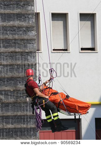 Fireman During An Exercise Carries The Stretcher With The Dummy