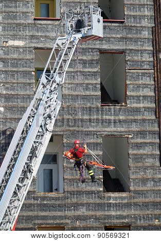 Fireman During An Exercise Carries The Stretcher With The Rope