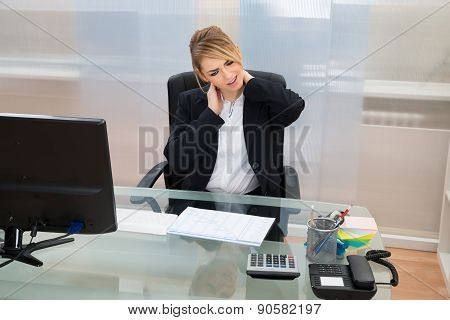 Young Businesswoman Suffering From Neckache
