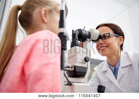 optician with tonometer and patient at eye clinic