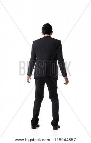 Asian business man surprised with outrageously and funny pose, full length portrait isolated