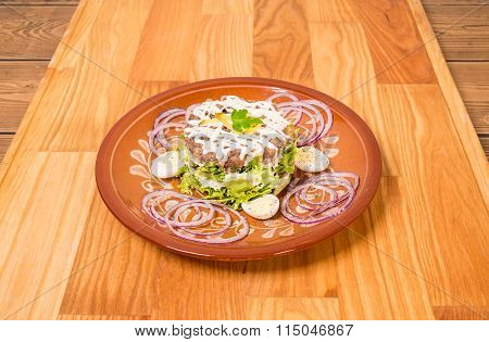 Beef steak tartare with garnish.