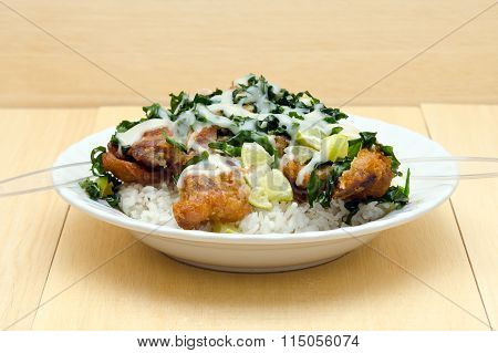 Fried Chicken With Lemon Sauce And Herb Over Rice (famous Thai Food)