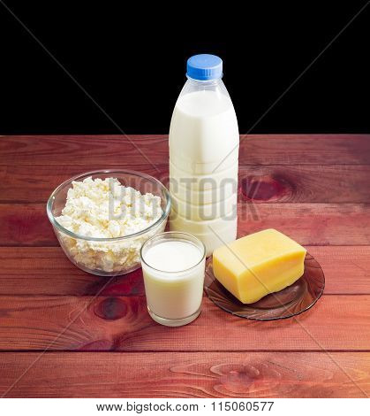 Dairy Produce On A Dark Wooden Surface