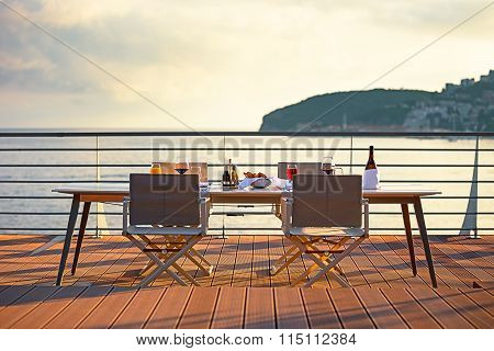 Table on the terrace at sunset