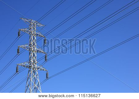 High Voltage Post. High-voltage Tower Blue Sky Background.
