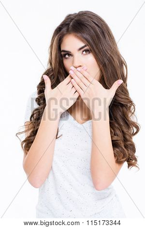 Portrait of a beautiul woman covering her mouth with palms isolated on a white background