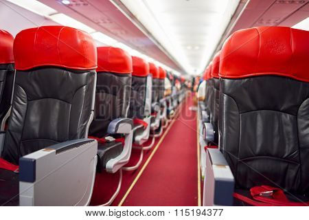 KUALA LUMPUR, MALAYSIA - MAY 02, 2014: interior of AirAsia Airbus A320-200. AirAsia Berhad is a Malaysian low-cost airline headquartered near Kuala Lumpur, Malaysia