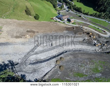 Men And Equipment Cleaning Up After The Mudslides