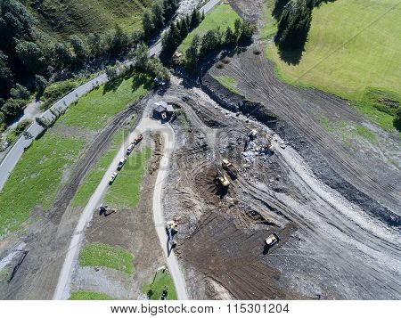 Men And Equipment Cleaning Up After The Mudslides