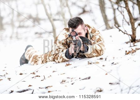 Young Sniper Aiming Through Scope And Shooting With Rifle During Operation - War Concept Or Hunting