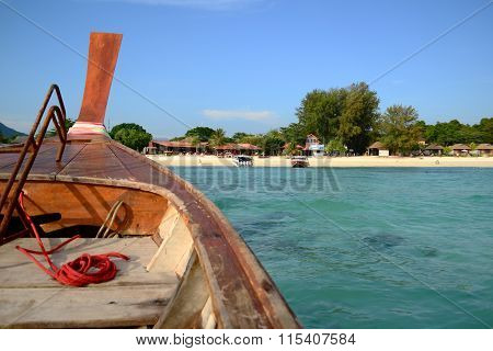 Thai Traditional Wooden Boat Head To The Beach On Island