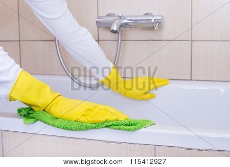 Woman Cleaning Bathtub