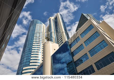 Modern high-rise office building on a background of clouds