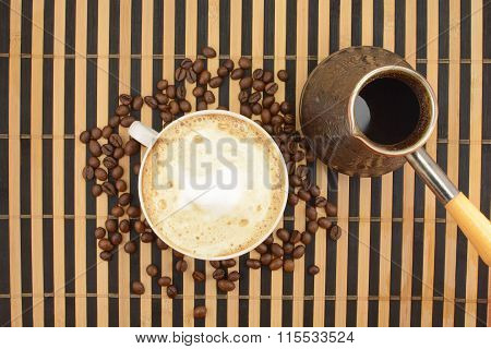 brewed coffee on the background of coffee beans