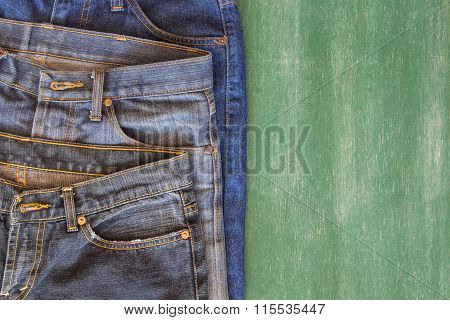 three pattern of jeans with chalkboard background and space for some text