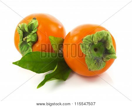 Ripe Whole Persimmons With Leaves