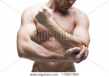 Pain In The Elbow. Muscular Male Body. Isolated On White Background