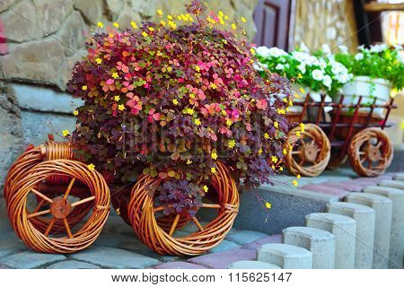 Artificial Flowers In A Cart