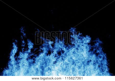 Raging blue fire shot at a high shutterspeed to freeze the motion of the flames