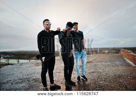 Three Rap Singers Band On The Roof