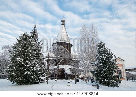 Wooden church and tree