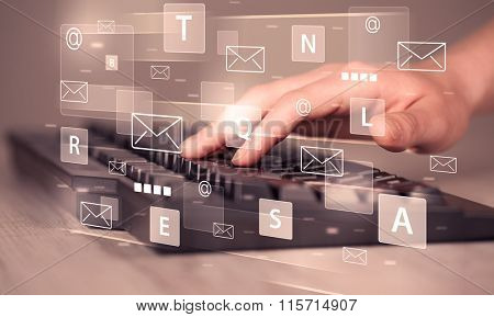 Hand typing on keyboard with digital tech icons and symbols