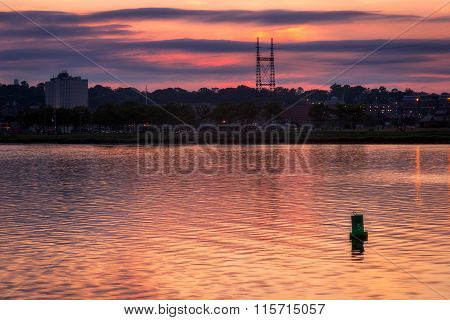 Lone Buoy In Harbor At Sunset