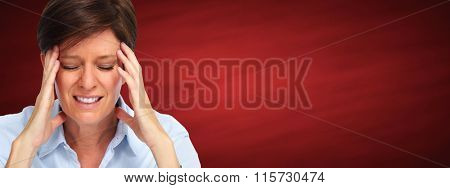 Woman having a migraine headache.