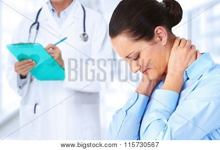 Woman having a neck pain.