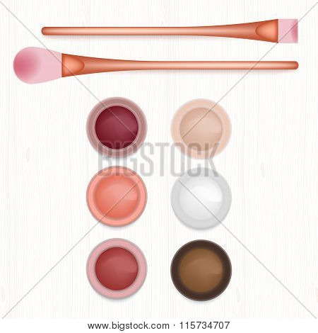 Set Of Colored Blushers And Brushes On White Wooden Table