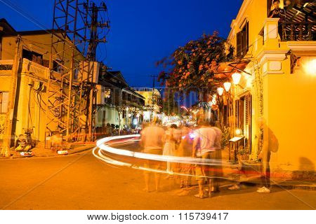 People on the street of Hoi An ancient town with long exposure effect, UNESCO World Heritage Site