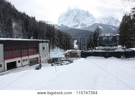 Dolomites skiing resort. Snowcat. Snow remover equipment.