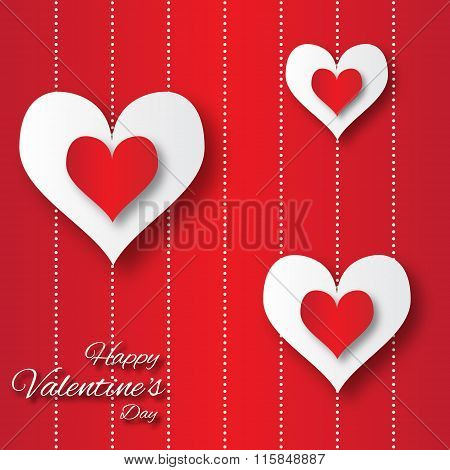 Valentine's day abstract applique background with cut red and white paper hearts.