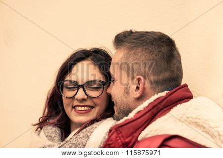 Young Happy Couple Of Lovers At Beginning Of Love Story - Handsome Hipster Man Whispers