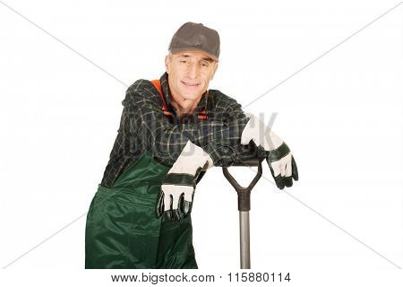 Mature gardener with a spade