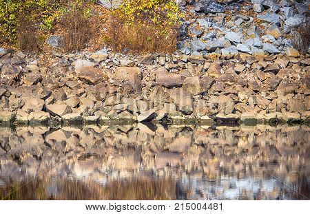Rough Texture Of Rock, Sandstone Reflection Water.