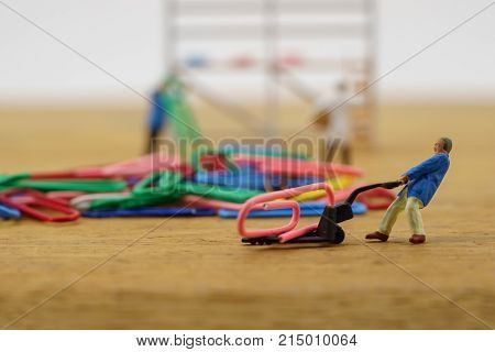 The concept of a collective solution to any problem. Workers perform disposal of the Chief. Close-up view.
