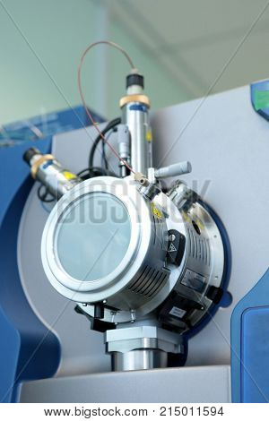 Adjust The Mass Spectrometer. The Man Analyzes The Device For Determining The Masses Of Atoms. Devic