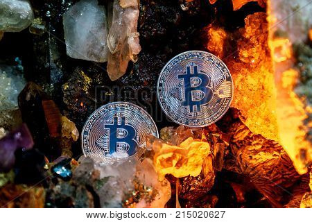 Silver bitcoin in a cave of precious stones. Bitcoin cryptocurrency.